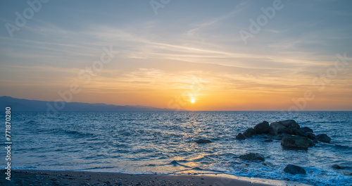 Bright sun at sunset. Mediterranean Sea