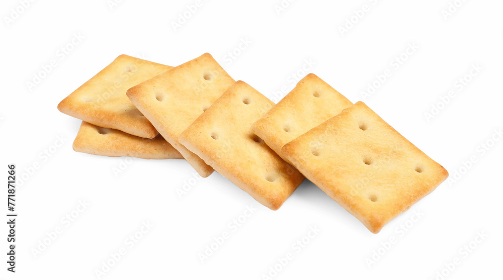 Tasty crispy square crackers isolated on white Tasty crispy square crackers isolated on white