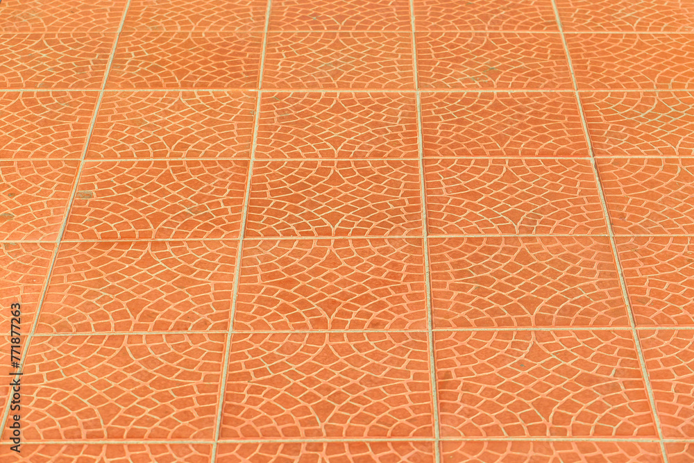 Fototapeta premium Orange brown paving slabs floor abstract pattern city street surface stone texture background tile mosaic