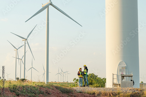 Engineers are working with wind turbines, Green ecological power energy generation, and sustainable windmill field farms. Alternative renewable energy for clean energy concept.