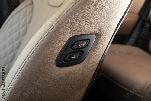 close-up of of seat setting buttons on car panel, no trade marks
