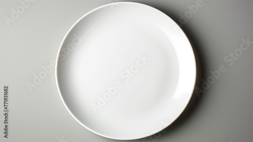 Empty white plate on a simple background