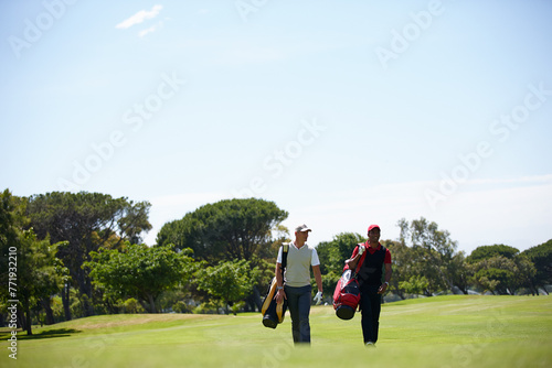Walking, course and people outdoor for golf, game and training together at club in summer. Golfer, competition and men on grass turf in park with happiness from practice of sport in healthy challenge