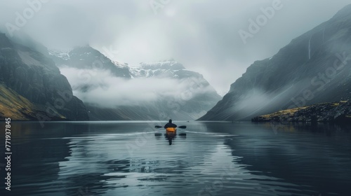 Kayaker in Misty Mountain Fjord