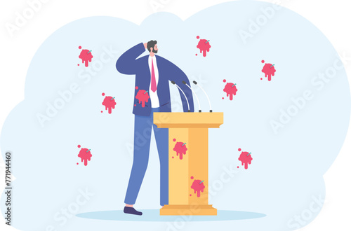 A man in a suit, business man, stands behind a rostrum with a microphone, having tomatoes thrown at him

