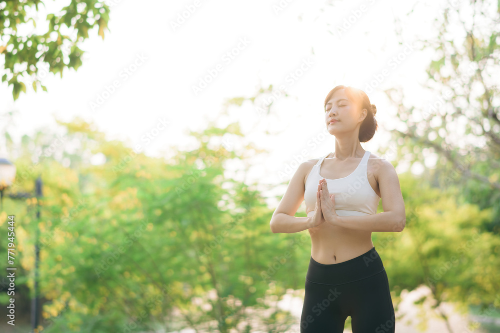 Female jogger. Fit young Asian woman with sportswear stretching muscle in park before running and enjoying healthy outdoor. Fitness runner girl in public park. Wellness being concept