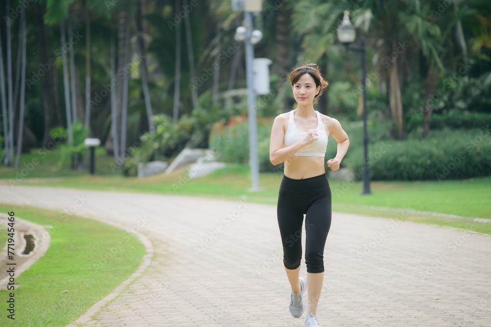 asian woman jogger running in green nature public park. asian woman jogger running in green nature public park.