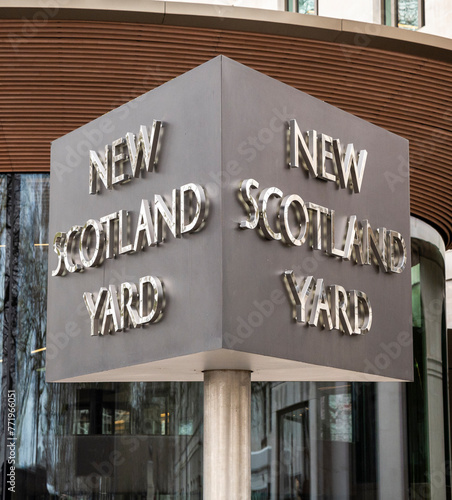 New Scotland Yard sign at the headquarters of the London Metropolitan police. photo