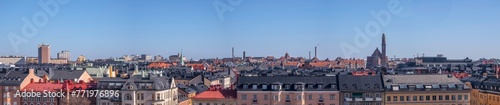 Panorama. Roofs, dorms, church and facades in the north district of Stockholm a sunny spring day