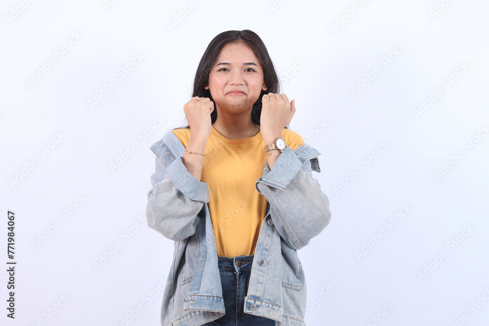 Young pensive sad woman of Asian ethnicity 20s with holding chin and sulking disappointed crying stand white background bothered. People lifestyle concept Young pensive sad woman of Asian ethnicity 20s with holding chin and sulking disappointed crying stand white background bothered. People lifestyle concept