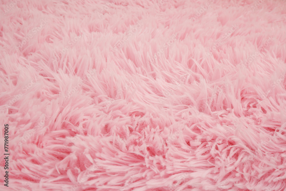 Close up of pink fur carpet background.	