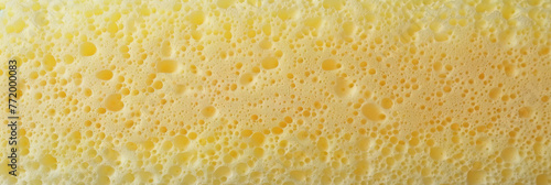 Yellow sponge texture material background, soft and smooth surface sponge, yellow spoon texture.banner photo