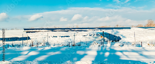 Winter wonderland view with a snow-covered photovoltaic system near Langenisarhofen, Deggendorf, Bavaria, Germany