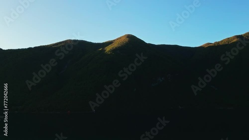 A mountain in the trees. A mountain. The top of mountains. Rocks. Top of the mountains. Nature. Mountainous terrain. Mountain with a lake. River, autumn, drone. Aerial shot, general plan. High quality