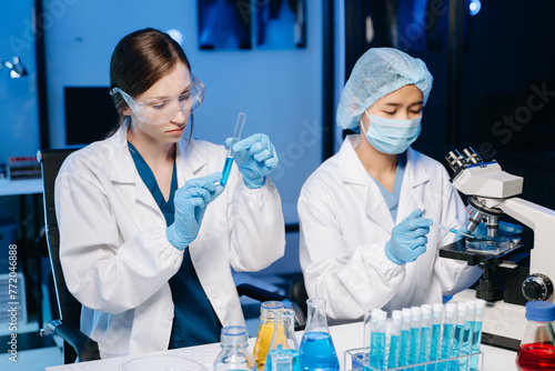 Two Female biotechnologist testing new chemical substances in a laboratory.