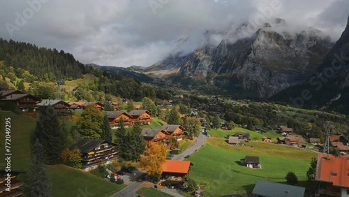 Mountain village. Switzerland. Autumn. A roadway. Cloudy weather. European city. Cozy village. Country life. Mountains. Forests. Mountains in the clouds. Alps. High quality 4k footage