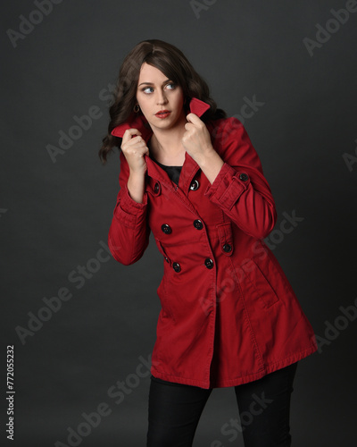 Fotografi close up portrait of beautiful brunette woman model, wearing red trench coat jacket