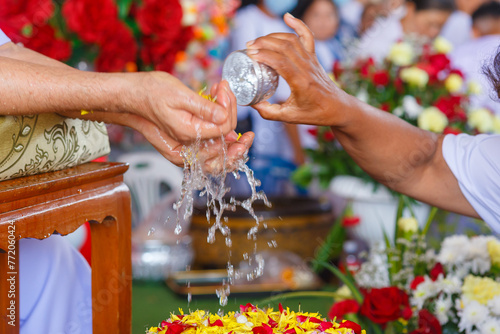 Thai New Year celebration, Rot Nam Dam Hua, Songkran Thai festival concept : Thai people celebrate Songkran in new year water festival by giving garlands to elder seniors and asked for blessings.