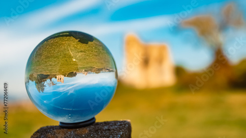 Crystal ball autumn or indian summer landscape shot with ancient castle ruins at Winzer, Danube, Deggendorf, Bavaria, Germany