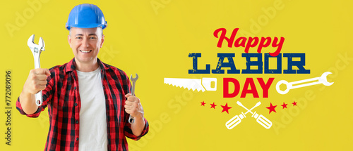 Mature worker with wrenches...