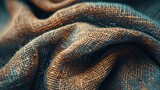 A close up of a piece of cloth with a brown and blue color. The cloth is made of a woven material and has a slightly fuzzy appearance