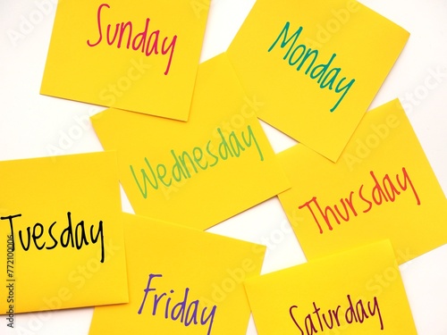 Seven days of the week background with yellow sticky notes. photo