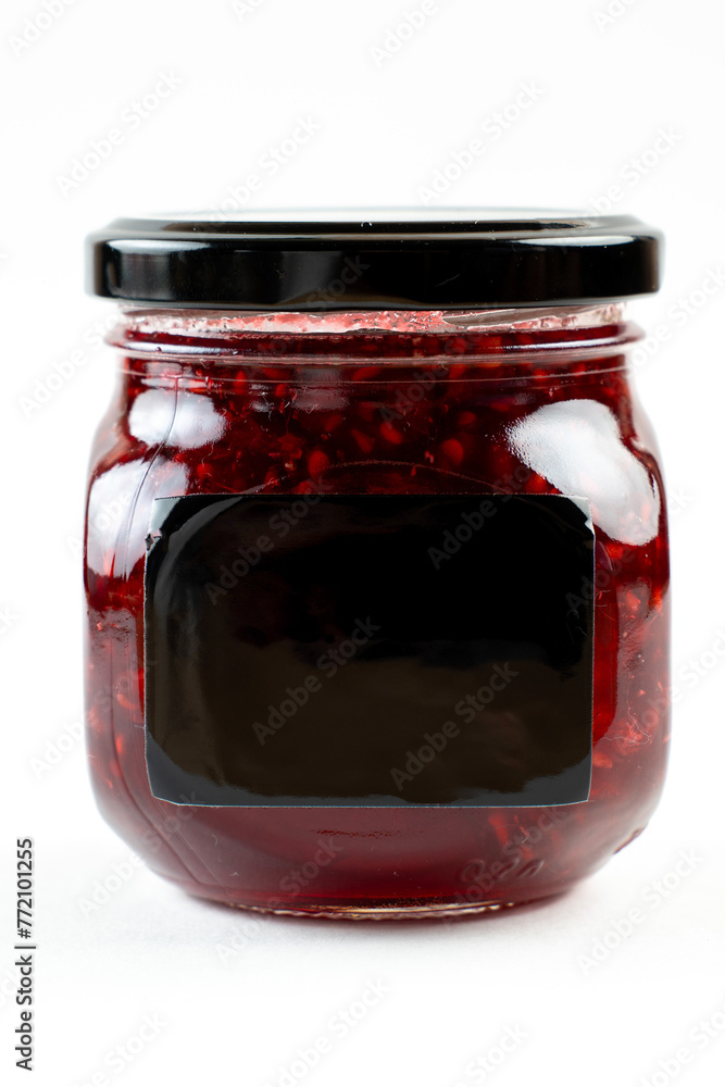 jar of raspberry jam on white background jar of raspberry jam on white background