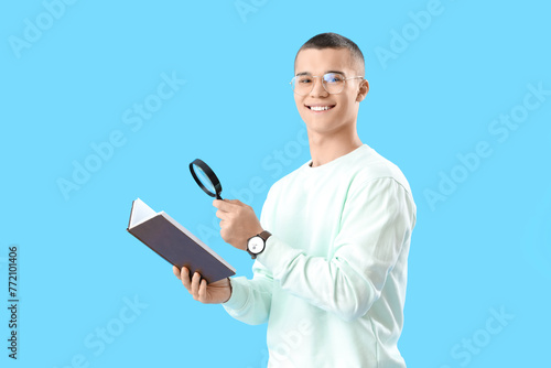 Young man with book and mag...