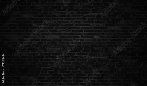 Panoramic background of wide black urban brick wall texture.