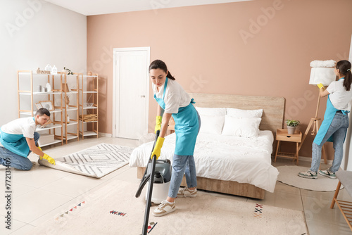 Young janitors cleaning in ...
