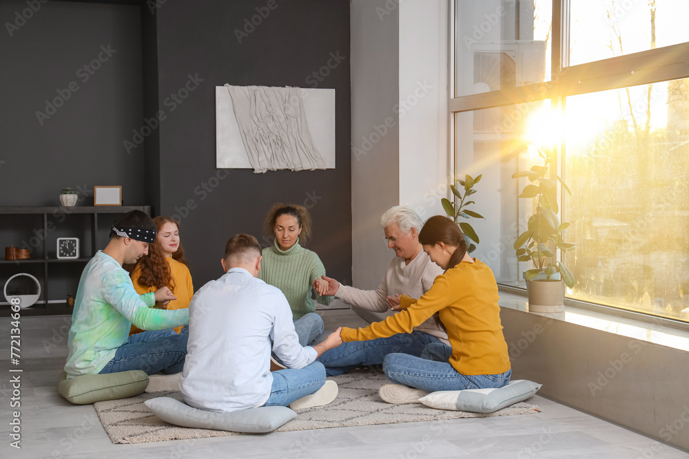 People praying on pillows at group therapy session People praying on pillows at group therapy session