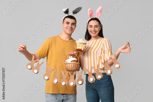 Happy young couple with Eas...