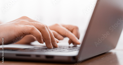 female hands typing on a computer, server and surfing the internet in a general office. hands adult working in an organization, internet network communication and working concept.