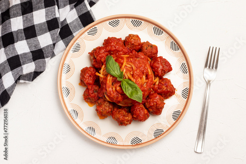 Spaghetti with meatballs in tomato sauce.