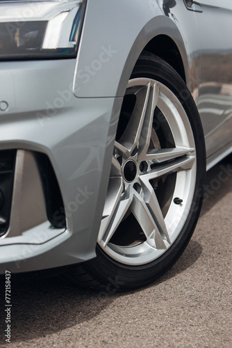 Front wheel of modern car with a rims and tyre © Moose