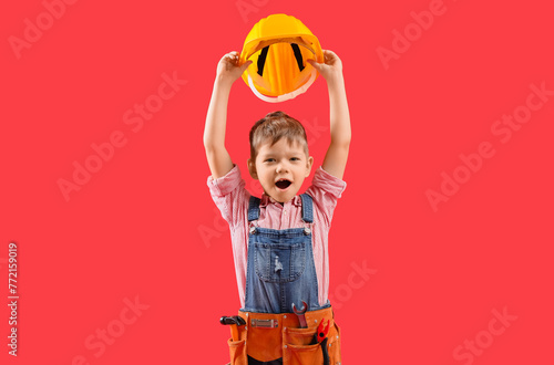 Cute little builder on red ...