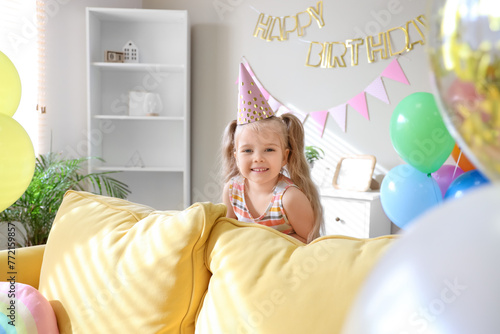 Cute little girl in party h...
