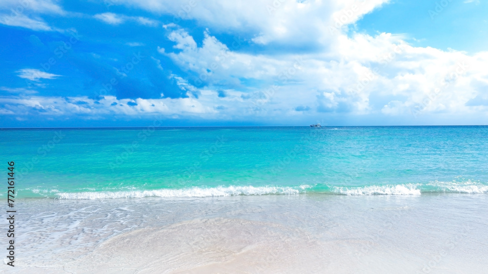 The soft wave water of the sea on the sandy beach background