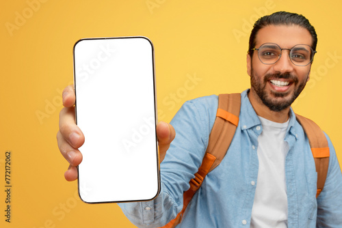 Man showing smartphone to camera photo