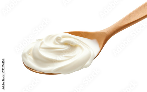A wooden spoon filled with fluffy whipped cream, ready to be enjoyed