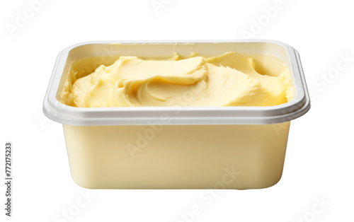 A container filled with smooth, creamy butter sits on a clean white background