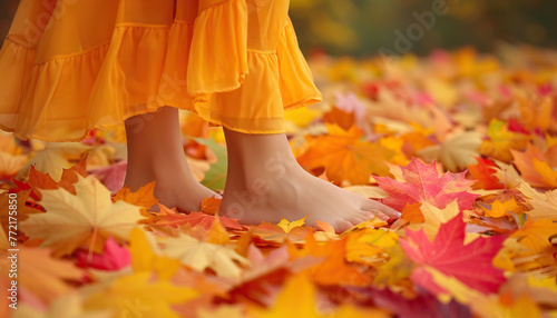 Nature's Dance: A picturesque scene capturing the elegance of a young woman's feet delicately standing amidst colorful autumn leaves, symbolizing the fleeting beauty of nature photo