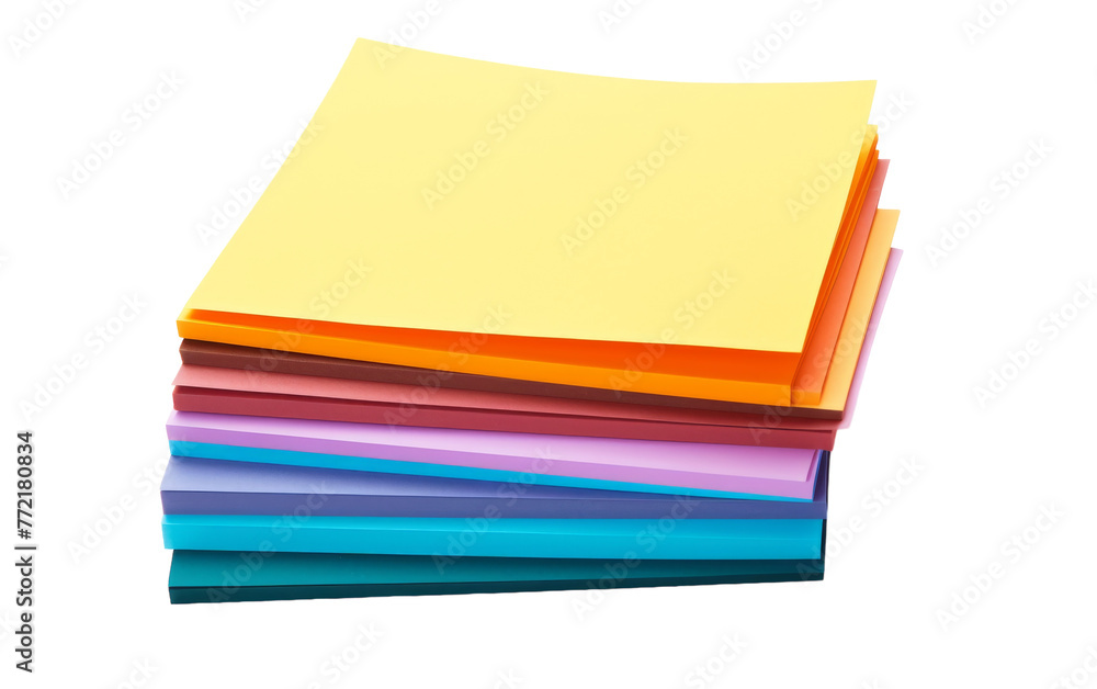 A vibrant stack of colored papers arranged neatly on a white background A vibrant stack of colored papers arranged neatly on a white background