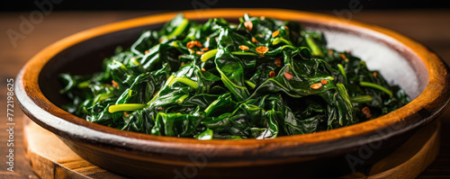 Green fresh spinach in a cast iron skillet photo