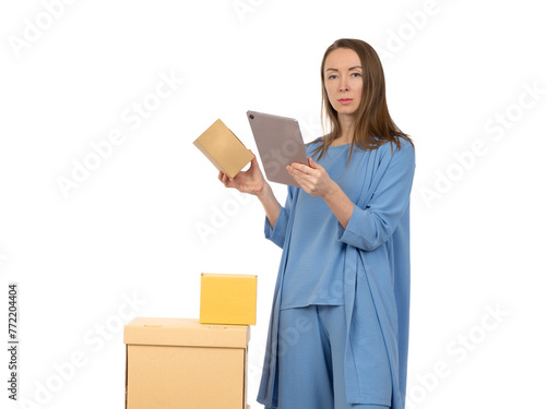 Woman with boxes and tablet...