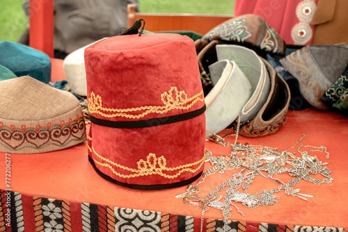 Traditional women's Asian headdresses are skullcaps made of thin velveteen with metal decorations. Close-up