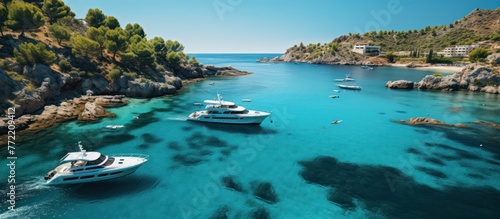 Aerial view of turquoise water bay with luxury yachts and sailboats