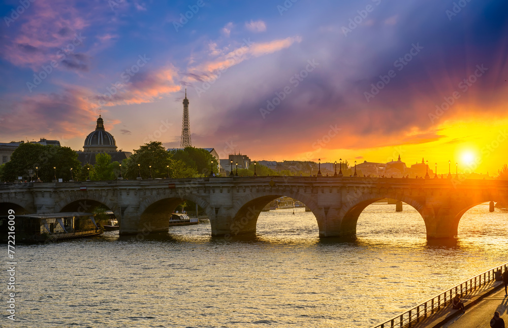 Pont Neuf  is the oldest standing bridge across the river Seine in Paris, France. Sunset cityscape of Paris. Architecture and landmarks of Paris