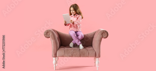 Cute little girl with table...