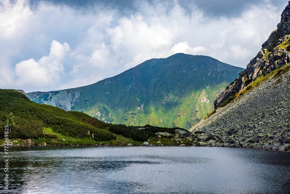 Tranquil lake surrounded by a majestic mountain landscape. Western Tatras, Slovakia. Tranquil lake surrounded by a majestic mountain landscape. Western Tatras, Slovakia.